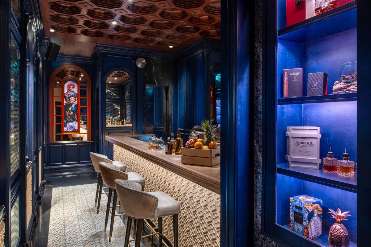 An intimate blue-panelled bar in Doha